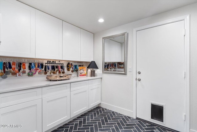 kitchen featuring white cabinetry