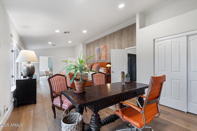 dining space with light hardwood / wood-style flooring