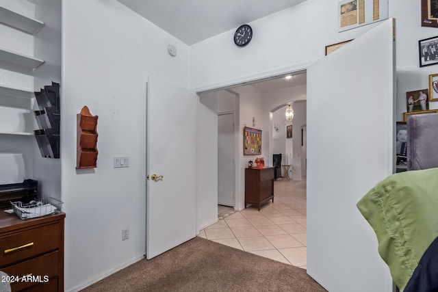 hallway with light carpet