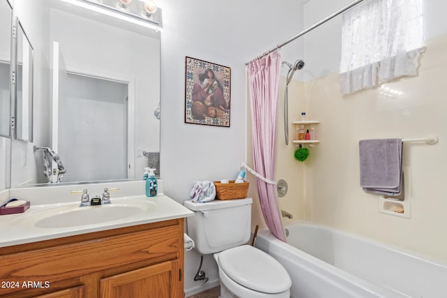 full bathroom featuring shower / tub combo with curtain, vanity, and toilet