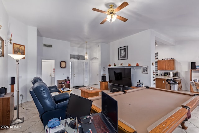 interior space featuring ceiling fan, light tile patterned floors, and pool table