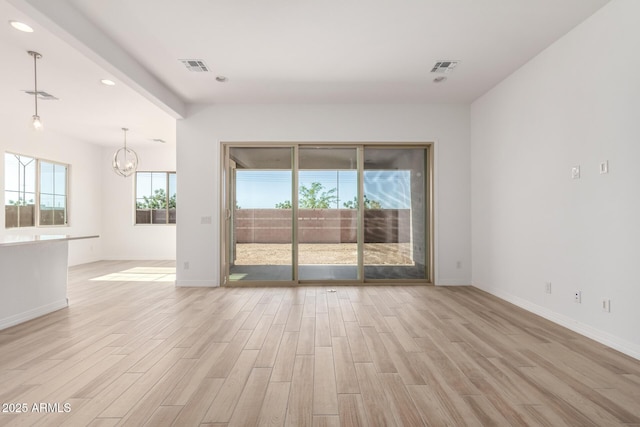 11660 W Luxton Ln, Avondale, AZ 85323 - empty room with light wood-style flooring, a chandelier, baseboards, and recessed lighting