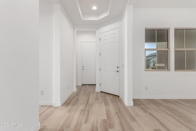 11660 W Luxton Ln, Avondale, AZ 85323 - hallway featuring wood finished floors, a tray ceiling, baseboards, and recessed lighting