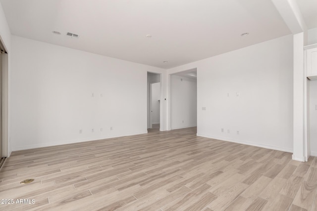11660 W Luxton Ln, Avondale, AZ 85323 - empty room with light wood-style floors and baseboards