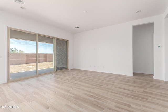 11660 W Luxton Ln, Avondale, AZ 85323 - empty room with light wood-type flooring and baseboards