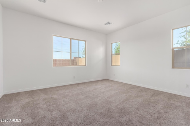 11660 W Luxton Ln, Avondale, AZ 85323 - spare room featuring carpet floors and baseboards