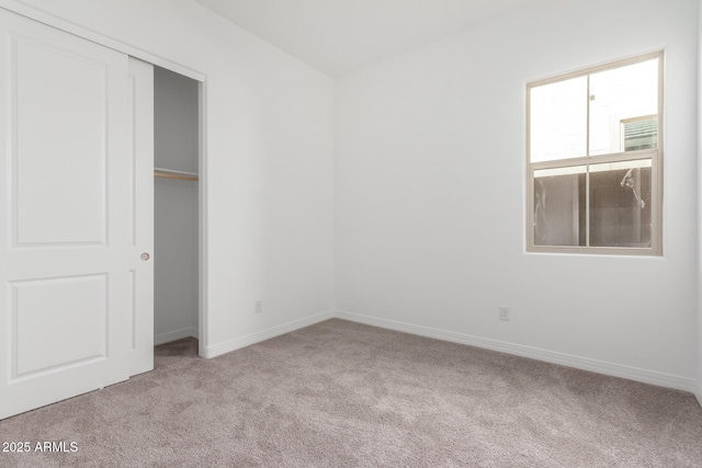 11660 W Luxton Ln, Avondale, AZ 85323 - unfurnished bedroom featuring carpet, baseboards, and a closet