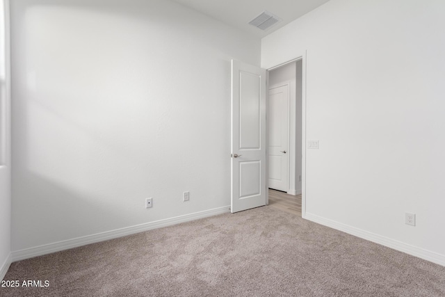 11660 W Luxton Ln, Avondale, AZ 85323 - empty room featuring light colored carpet and baseboards