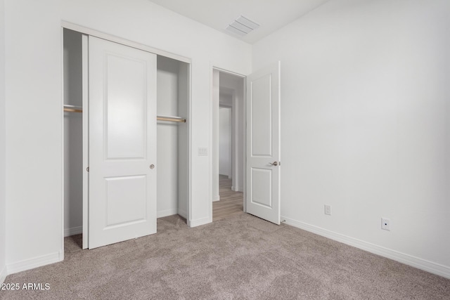 11660 W Luxton Ln, Avondale, AZ 85323 - unfurnished bedroom with carpet floors, a closet, and baseboards