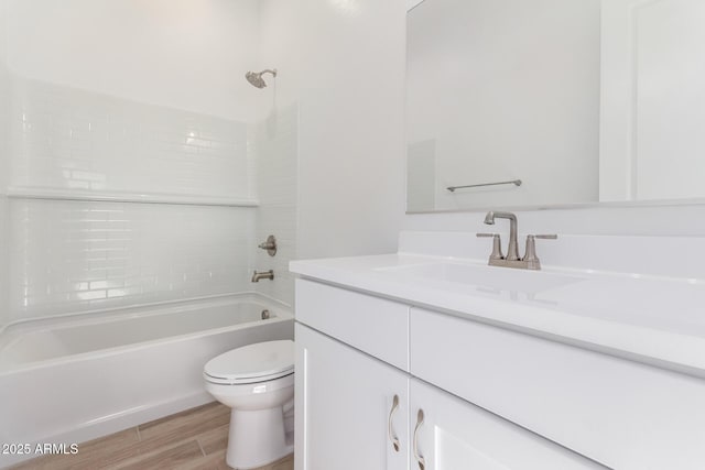 11660 W Luxton Ln, Avondale, AZ 85323 - bathroom featuring wood finished floors, toilet, shower / washtub combination, and vanity