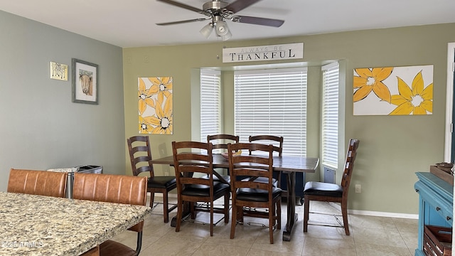 tiled dining room with ceiling fan