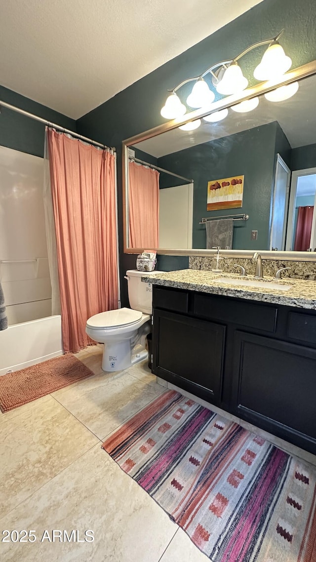 full bathroom with vanity, shower / bath combination with curtain, a textured ceiling, and toilet