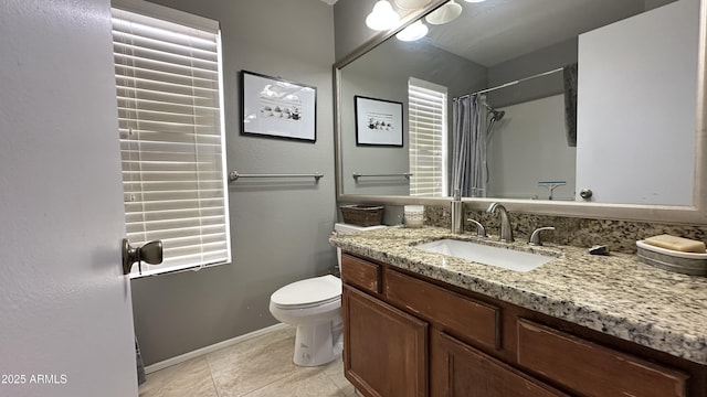 bathroom featuring tile patterned flooring, vanity, a shower with shower curtain, and toilet