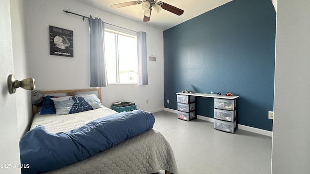 bedroom with concrete flooring and ceiling fan