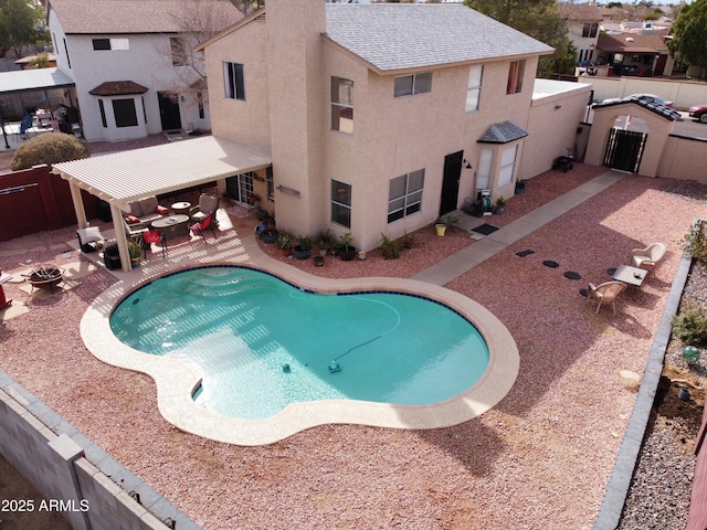 view of swimming pool with a patio area and a pergola