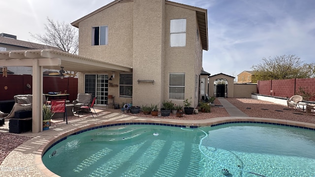 view of pool with a patio area, ceiling fan, and a pergola