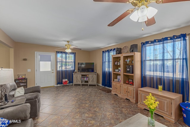 tiled living room featuring ceiling fan