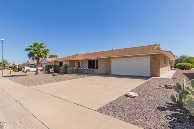 ranch-style home featuring a garage