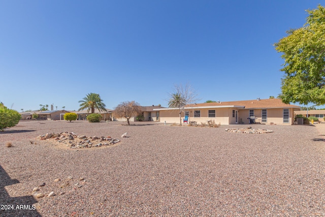 rear view of property featuring a patio