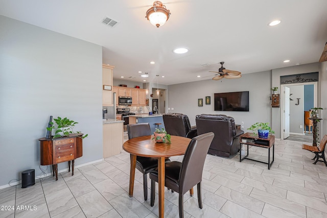 dining area with ceiling fan