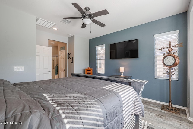 bedroom with ceiling fan and hardwood / wood-style floors