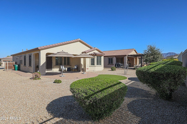 rear view of property with a patio area