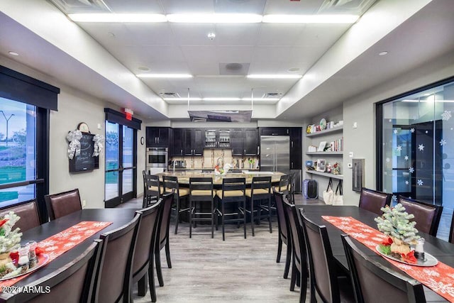 dining space featuring light hardwood / wood-style flooring