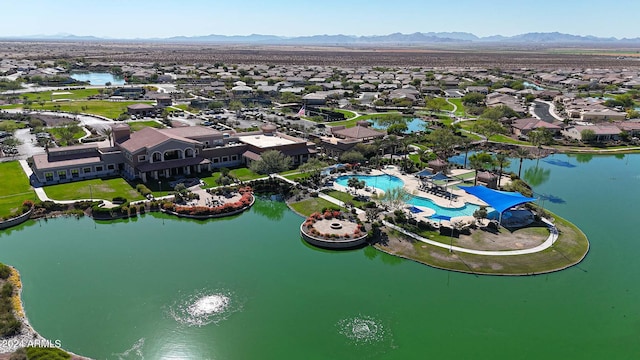 birds eye view of property featuring a water and mountain view