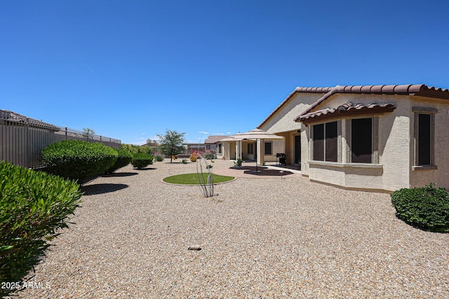 view of yard featuring fence and a patio area