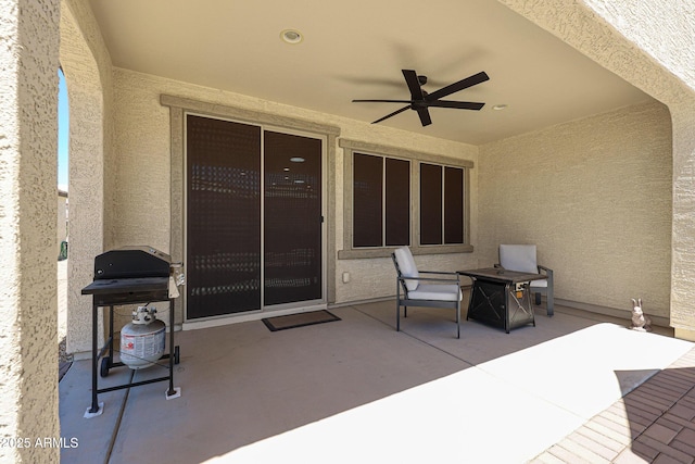 view of patio with grilling area and ceiling fan