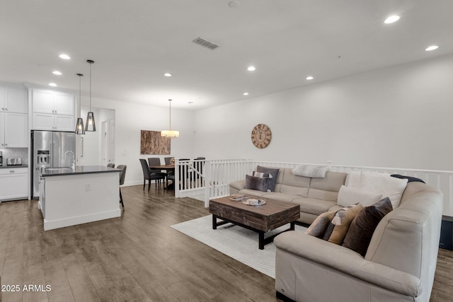 6565 E Thomas Rd Unit 1096, Scottsdale, AZ 85251 - living room with recessed lighting and wood finished floors