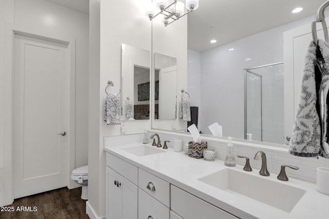 6565 E Thomas Rd Unit 1096, Scottsdale, AZ 85251 - full bath with toilet, double vanity, decorative backsplash, a stall shower, and wood finished floors