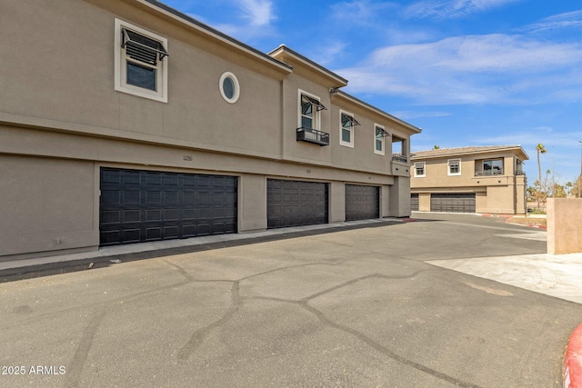 6565 E Thomas Rd Unit 1096, Scottsdale, AZ 85251 - view of front facade featuring stucco siding and an attached garage