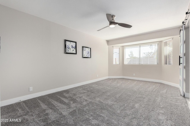 unfurnished room featuring carpet floors and ceiling fan