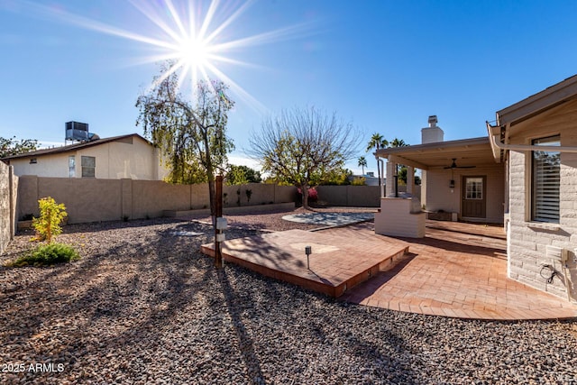 view of yard with a patio and ceiling fan