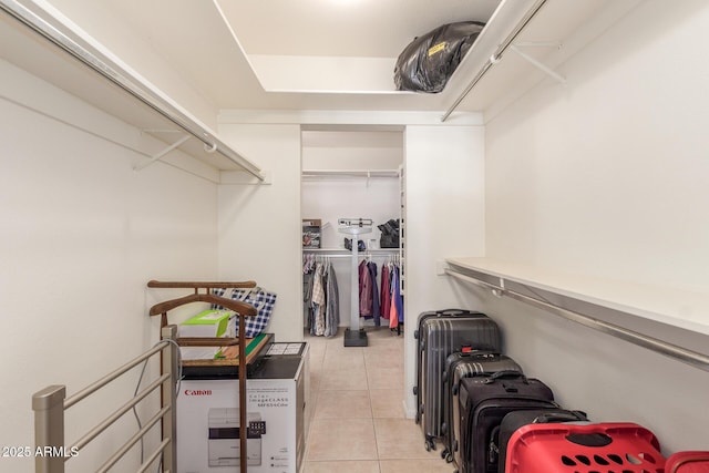 walk in closet featuring light tile patterned floors