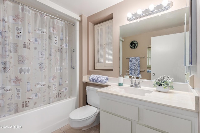 full bath with vanity, shower / bath combo with shower curtain, toilet, and tile patterned floors