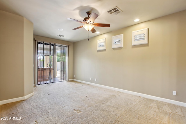 empty room with light carpet, visible vents, recessed lighting, and baseboards