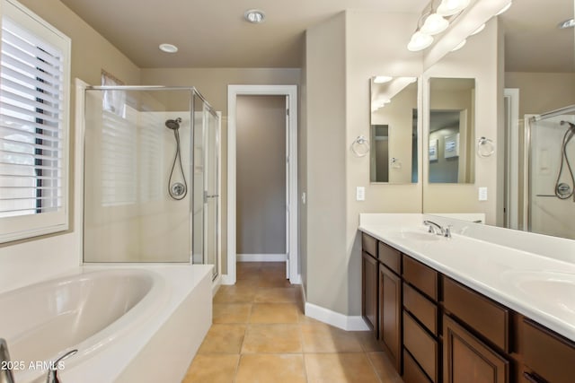 full bath featuring tile patterned floors, a shower stall, a bath, and double vanity