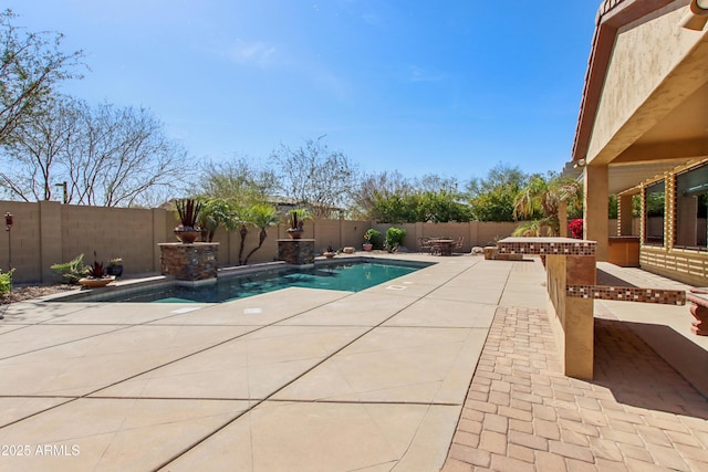 view of pool featuring a patio and a fenced backyard