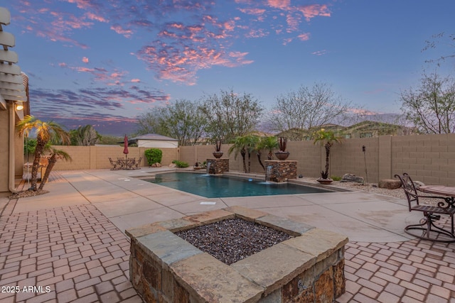 view of swimming pool with a patio and a fenced backyard