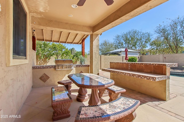 view of patio / terrace with grilling area, a fenced backyard, and outdoor dining space