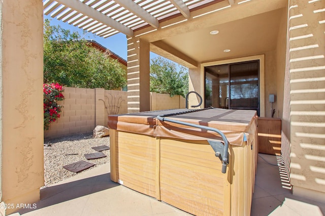 view of patio / terrace featuring a pergola and fence