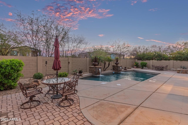 view of pool with a patio area and a fenced backyard