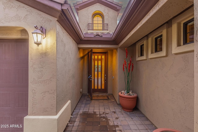 doorway to property featuring a garage