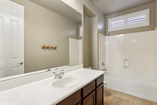 bathroom with vanity, tile patterned floors, toilet, and bathtub / shower combination