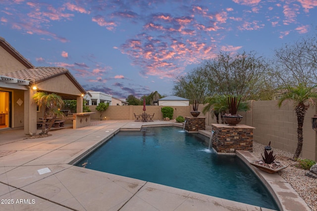 view of pool with a patio, outdoor dining area, a fenced backyard, and a fenced in pool