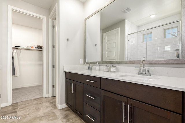 bathroom with vanity and an enclosed shower