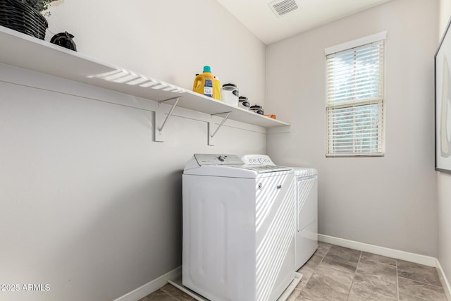 laundry area with separate washer and dryer