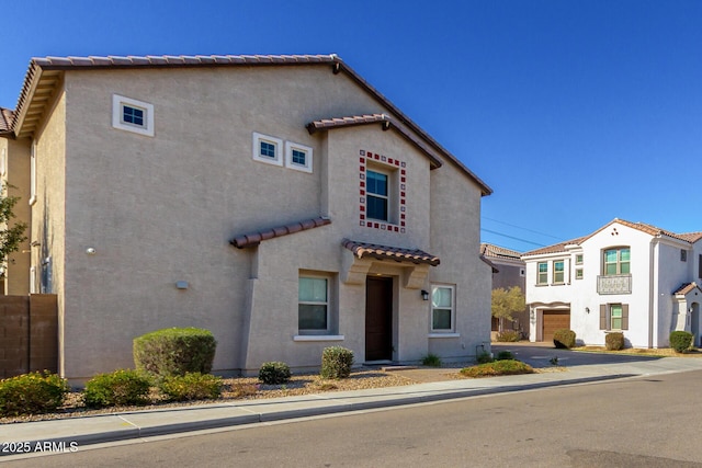 mediterranean / spanish house featuring a garage